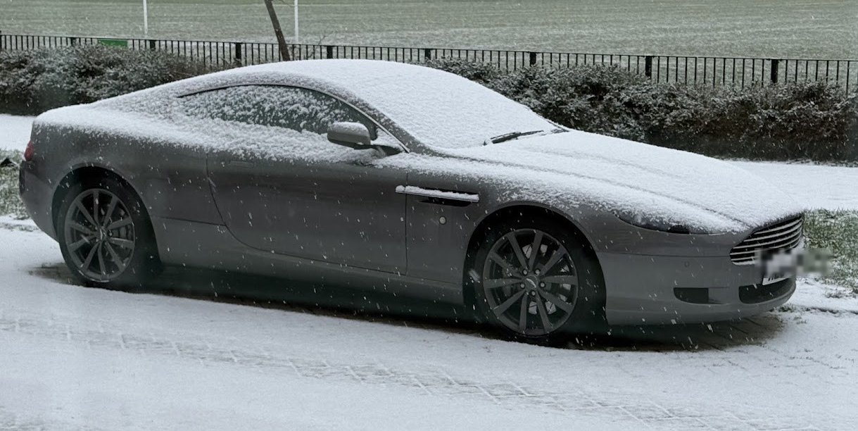 Aston Martin DB9 in falling snow